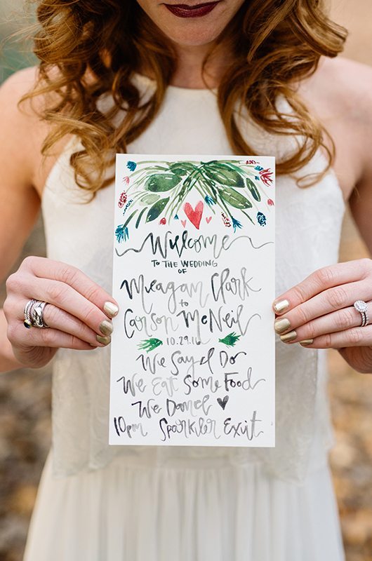 bohemian_fall_harvest-bride_holding_invite