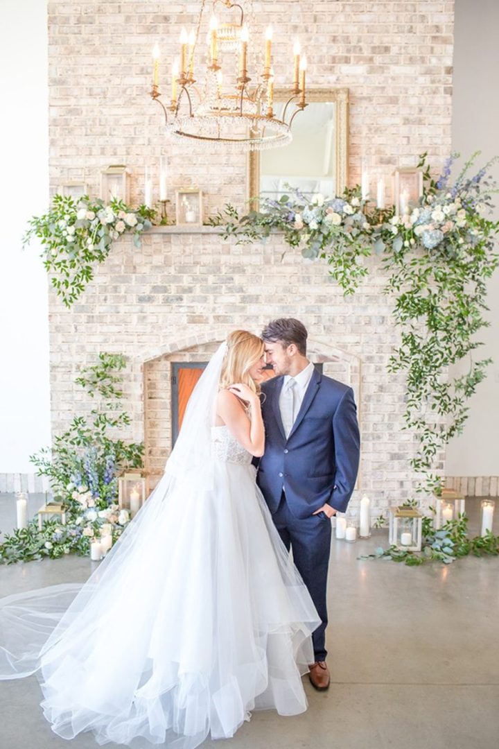 Dusty_Blue_Gold_Wrightsville_Manor_Wedding-couple_and_fireplace