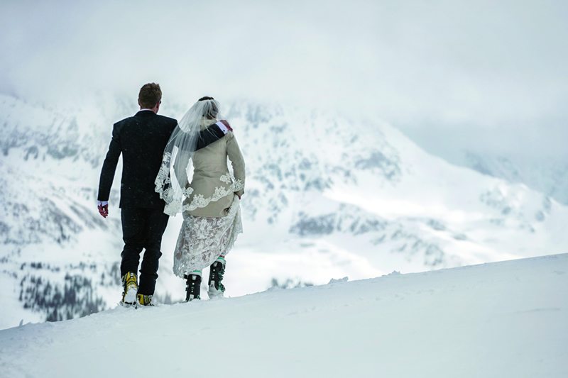 Copper_Mountain_Colorado-Bride_And_Groom_Walking_Through_Snow