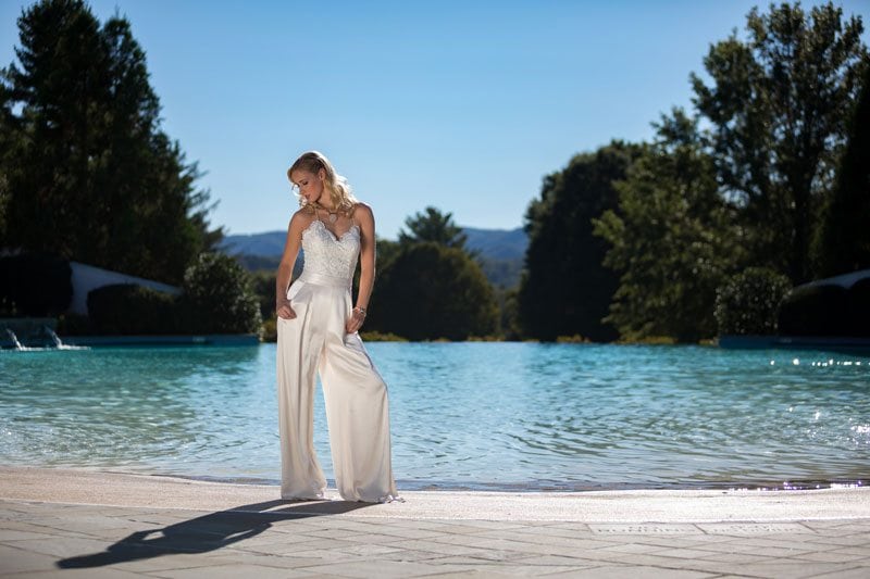 Chic_Wedding_Jumpsuit_by_BHLDN-looking_away_by_pool