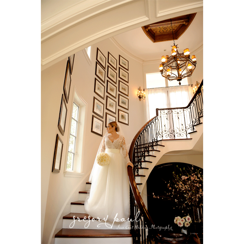 Events by Elle Inc bride coming down stairs