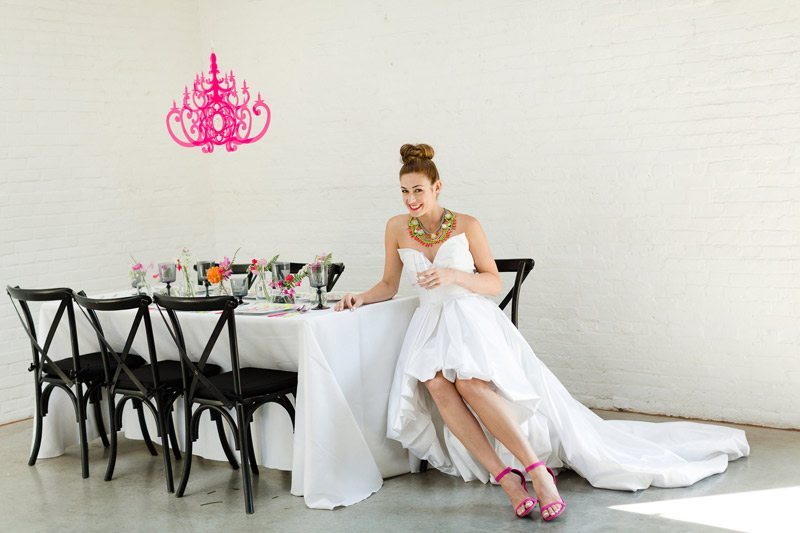 Portable_Elegance_for_any_Venue-black_chairs_with_pink_chandelier