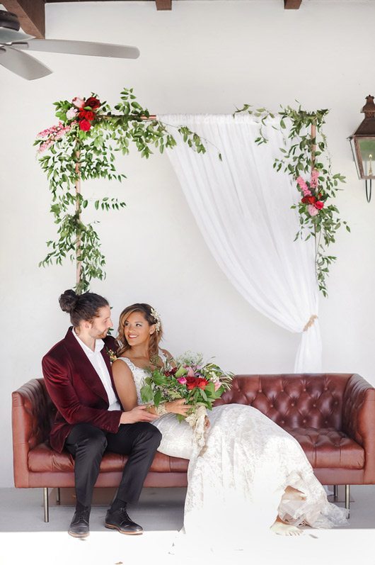 Spanish_Styled_Wedding-bride_and_groom_on_couch