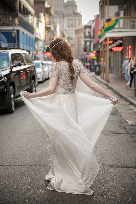 Anya_Gown-bride_walking_in_street_back_of_dress