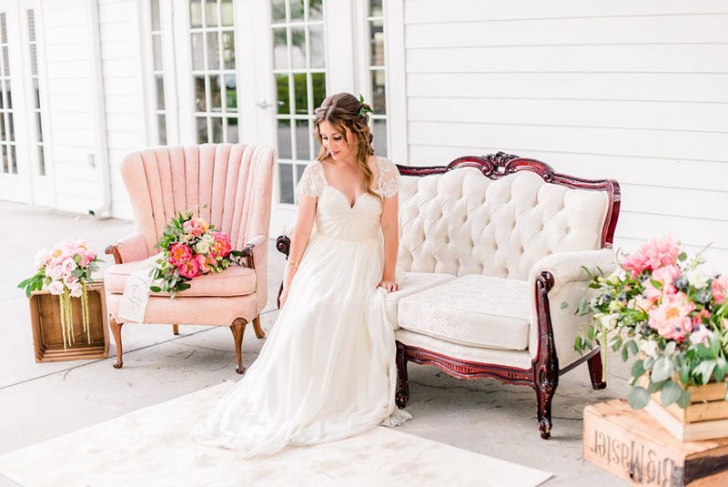 Dusty_Blue_Wedding-bride_sitting_on_couch