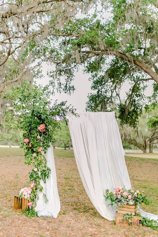 Dusty_Blue_Wedding-flowers_with_white_curtain