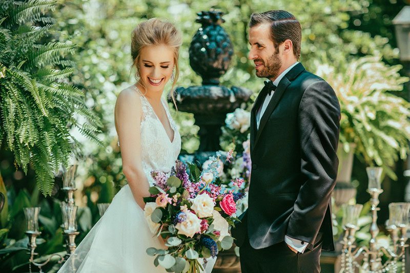 French_Inspired_Shoot-groom_looking_at_blushing_bride