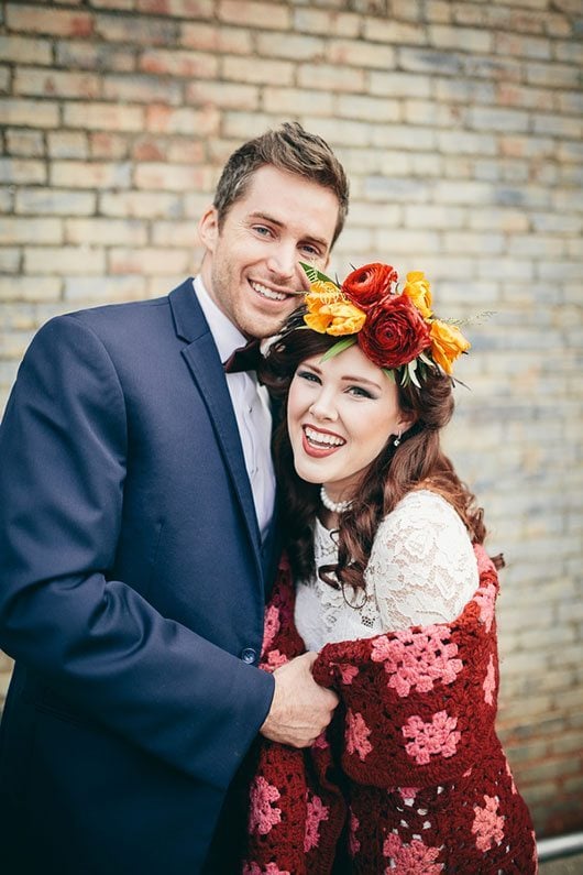 Industrial_Warehouse_Shoot-bride_and_groom_laughing_with_blanket