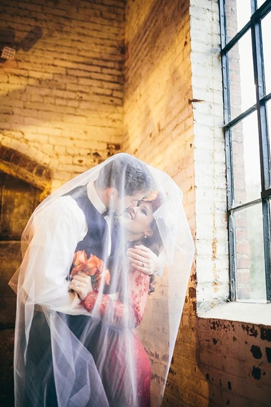 Industrial_Warehouse_Shoot-bride_and_groom_under_veil