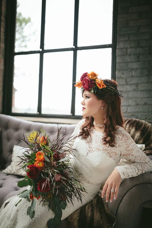 Industrial_Warehouse_Shoot-bride_sitting_on_couch_by_window