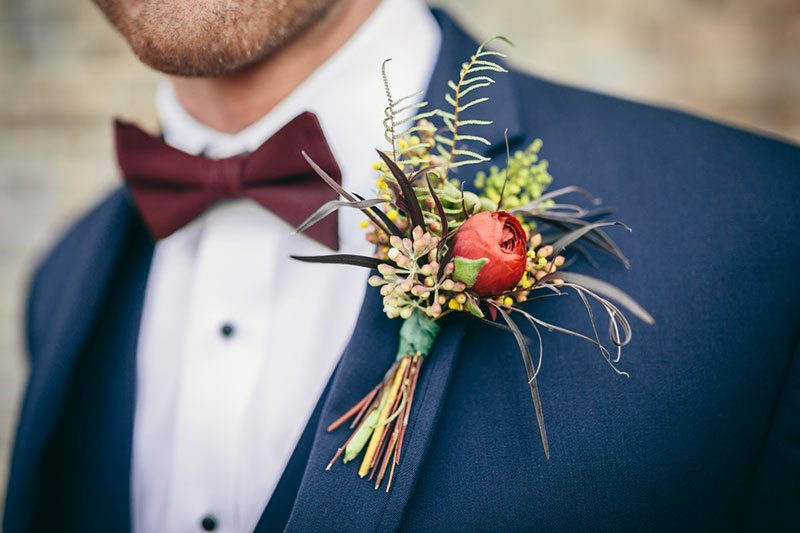 Industrial_Warehouse_Shoot-groom_with_red_flower