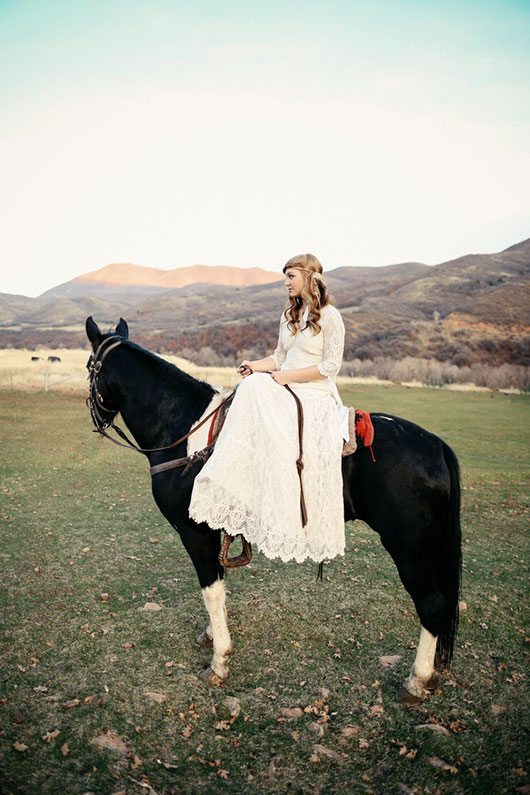 Outdoor_wedding-bride_riding_black_horse