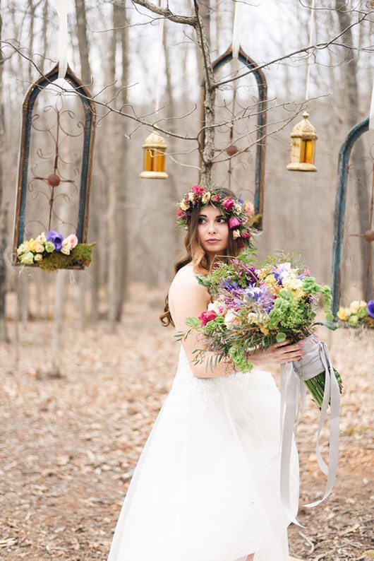 Outdoor_wedding_with_pops_of_color-bride_holding_flowers_in_woods