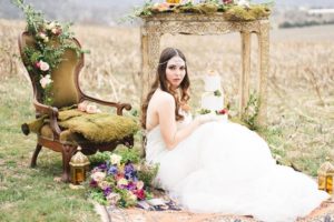 Outdoor_wedding_with_pops_of_color-bride_sitting_on_ground