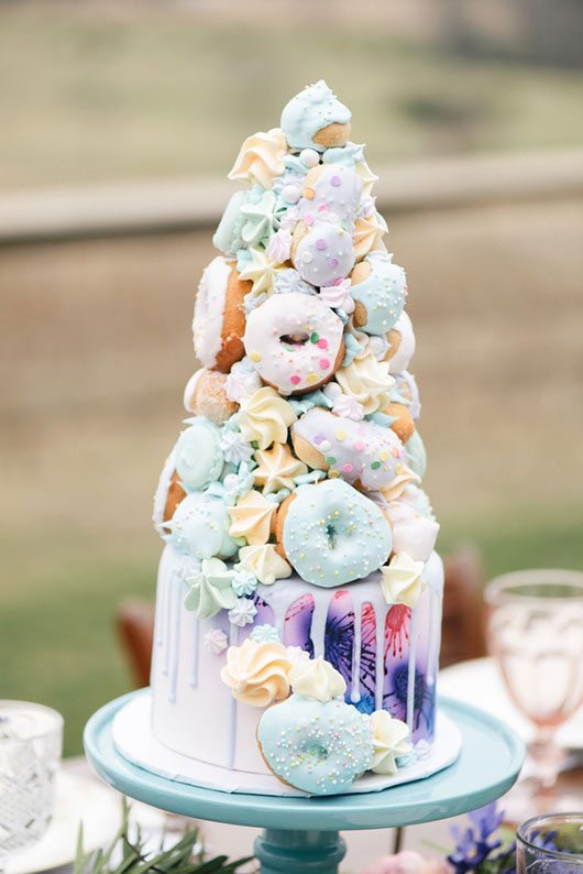 Outdoor_wedding_with_pops_of_color-colorful_cake_with_donuts