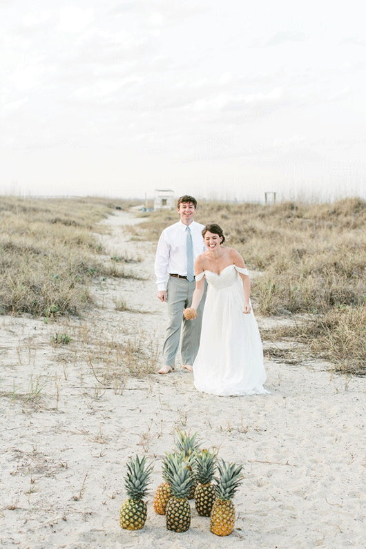 Oyster_Wedding-bride_and_groom_bowling_on_the_beach