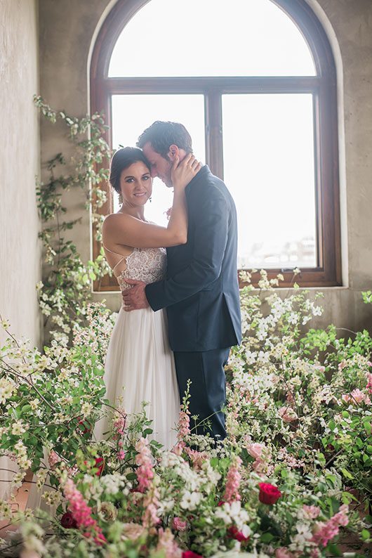 Shades_of_Love-bride_and_groom_in_room_of_flowers