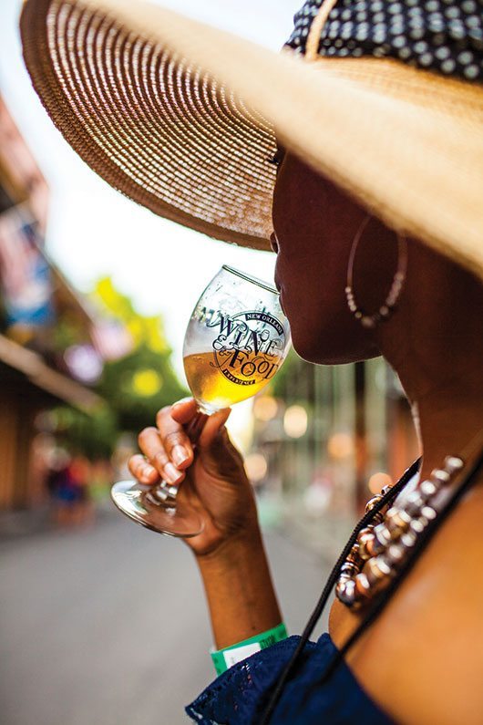 10 Things To Do In NOLA Woman Drinking Wine