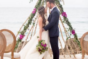 Chic_Coastal_Wedding-bride_and_groom_on_beach