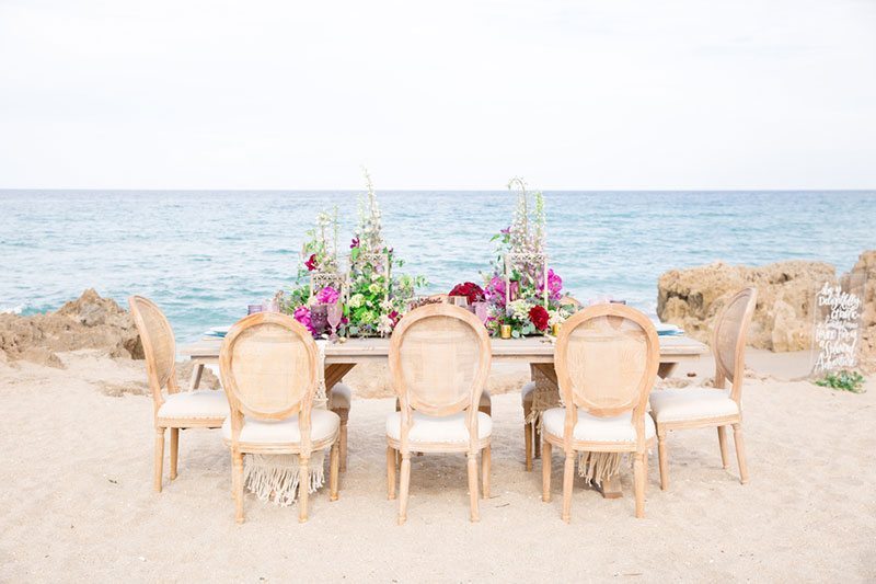 Chic_Coastal_Wedding-wide_view_of_table_with_chairs