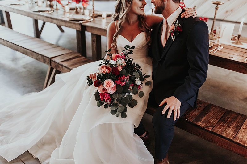 Enchanted_Forrest_Wedding-bride_and_groom_sitting_by_table