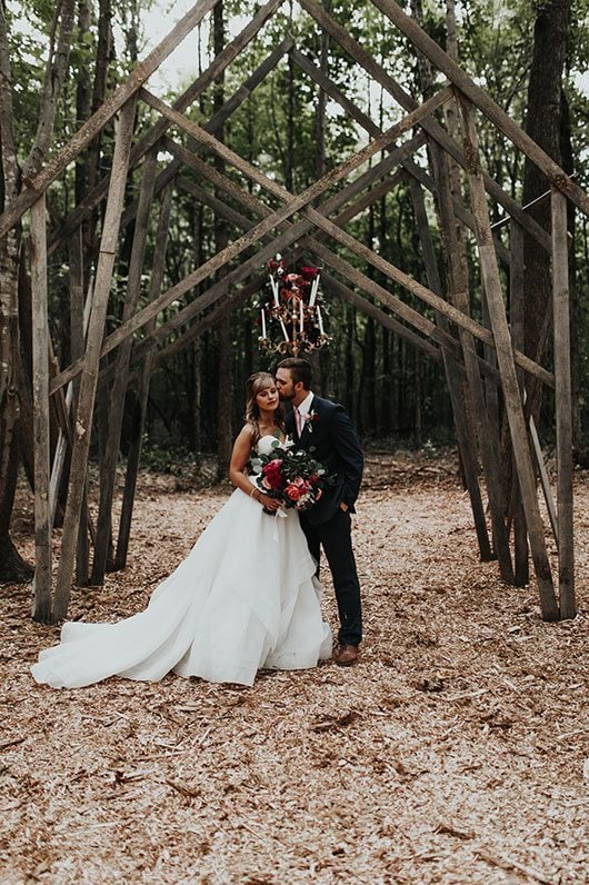 Enchanted_Forrest_Wedding-groom_kissing_bride