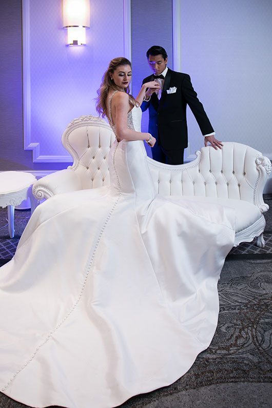 Fashion Mori Lee Bride And Groom By White Couch