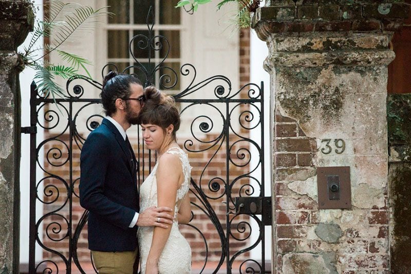 French_Boho-bride_and_groom_by_fence