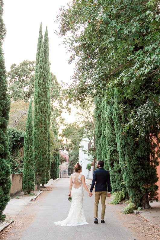 French_Boho-bride_and_groom_holding_hands