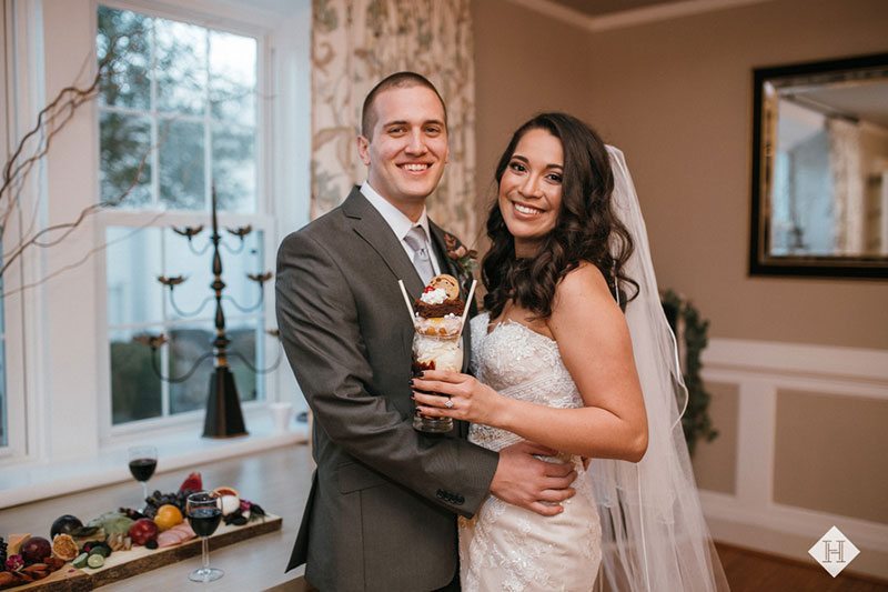 Modern_rustic_wedding-bride_and_groom_holding_milkshake