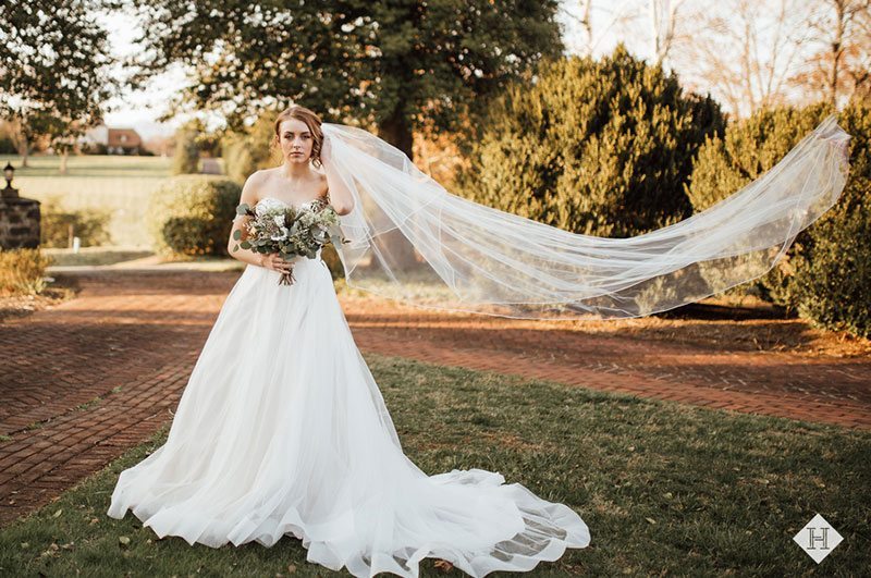 Modern_rustic_wedding-bride_with_flowing_veil