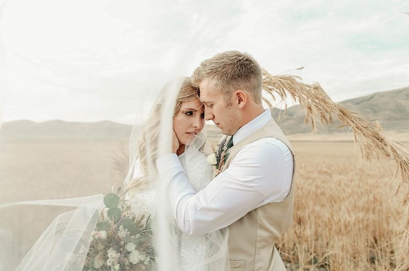 Bountiful Wheat Harvest Bride And Groom In Field With Veil