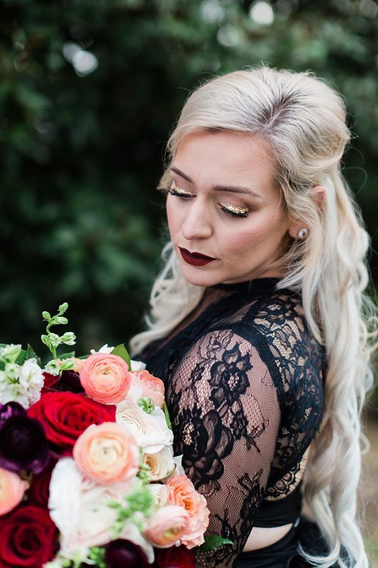 Mastrangelo Bride Holding Flowers Looking Down