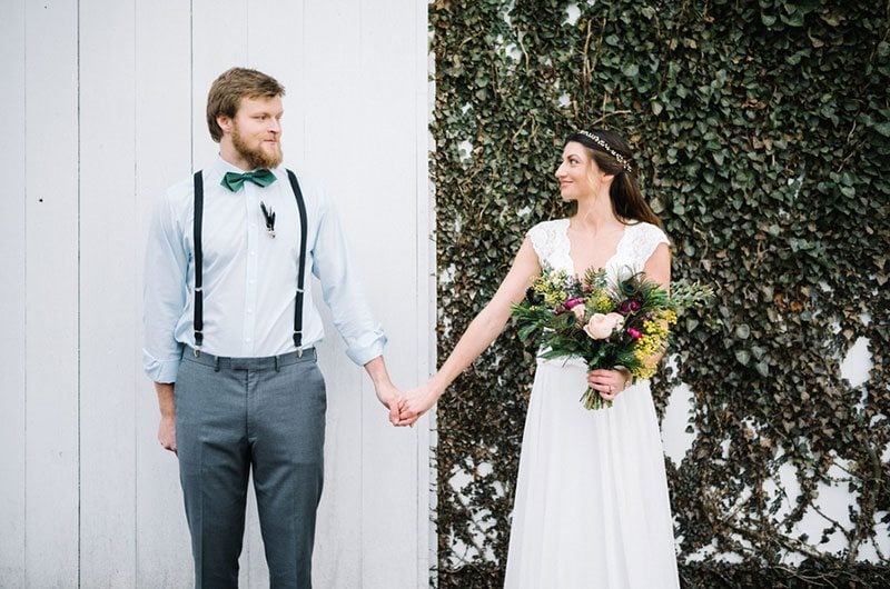 Modern Boho Bride And Groom Holding Hands