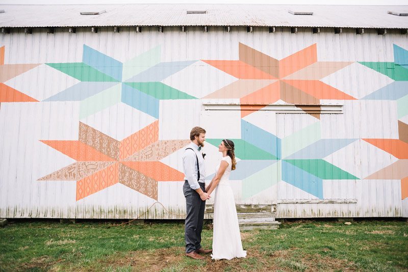 Modern Boho Bride And Groom In Front Of Buildings