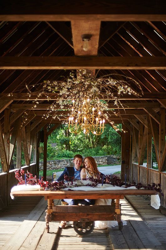 Pink Wedding Bride And Groom Laughing On Wooden Bridge