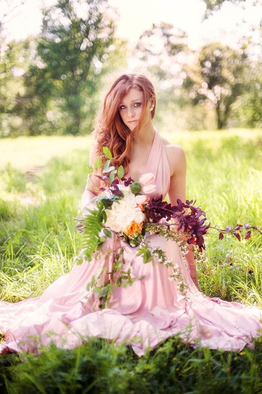 Pink Wedding Bride Sitting In Field