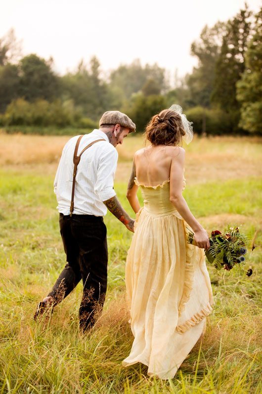 Snoqualmie Falls Bride And Groom Walking Holding Flowers