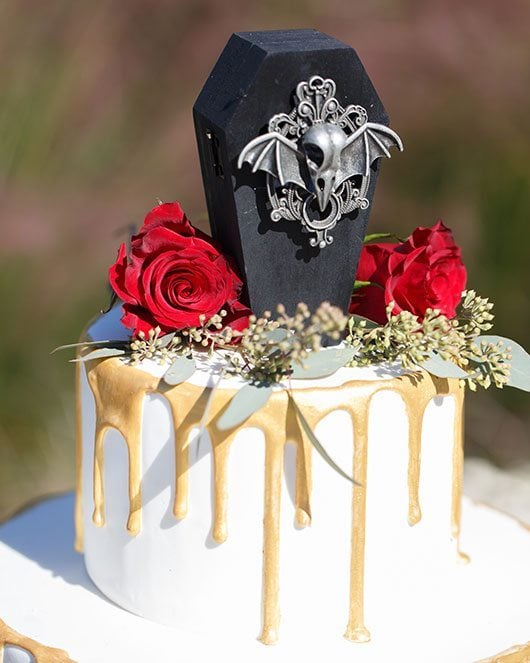 Vampire Wedding Cake With Coffin And Flowers On Top