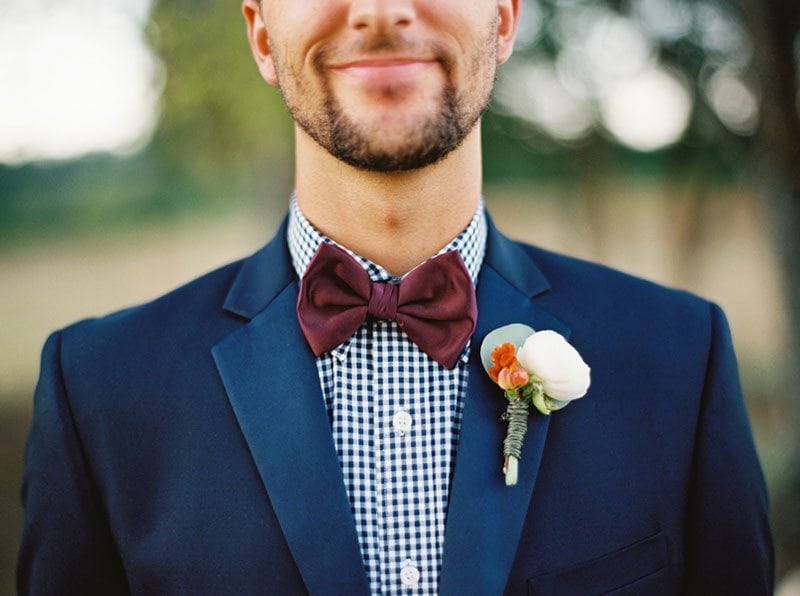 Autumn Groom Holding Flowers