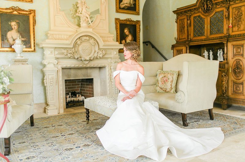 Chic And Modern Bride In White Dress Sitting