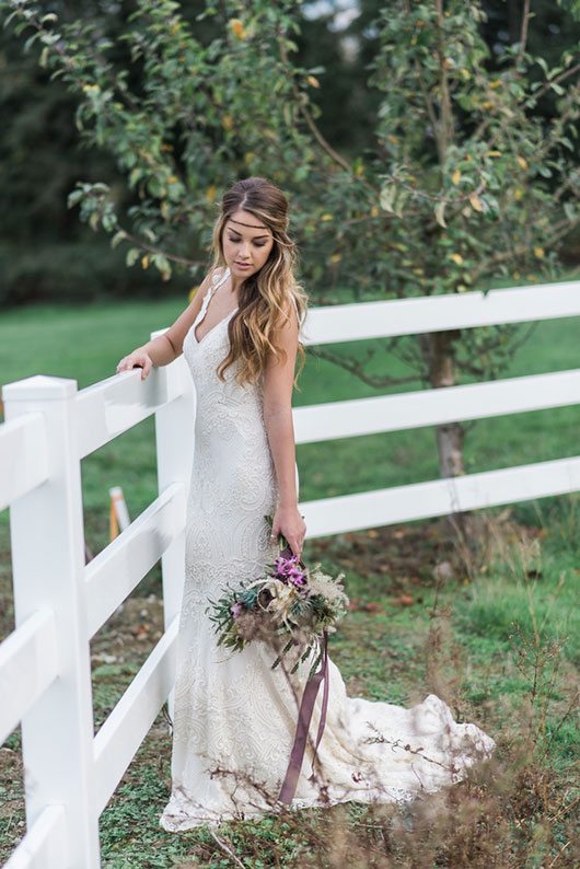 Countryside Bride Standing By White Fence