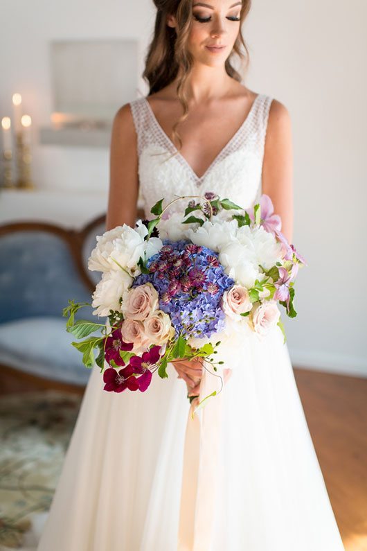 Enchanted Bride Holding Flowers