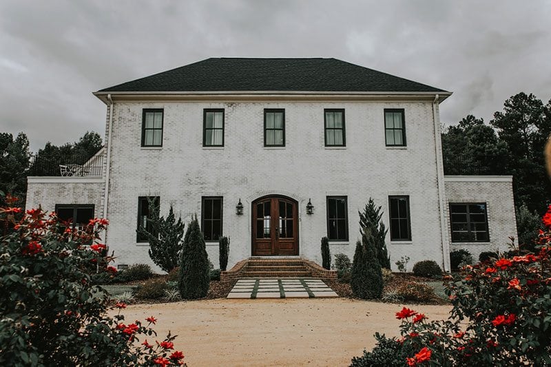 Gatsby White House With Rose Bushes