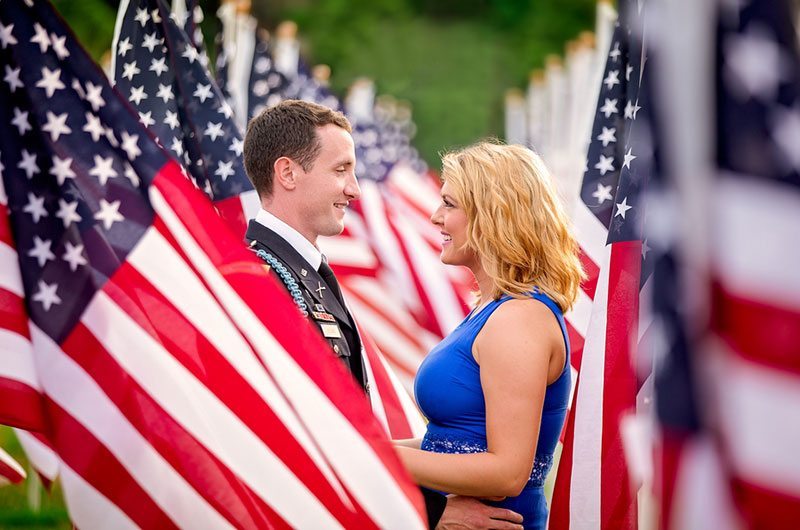 Patriotic Standing Between Flags