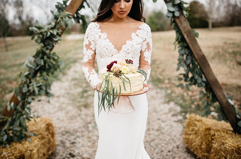 Timeless Territory Bride Holding Cake