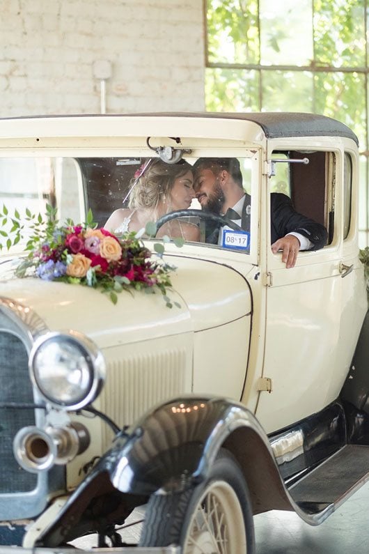 Vintage Copper Bride And Groom Inside Vintage Car