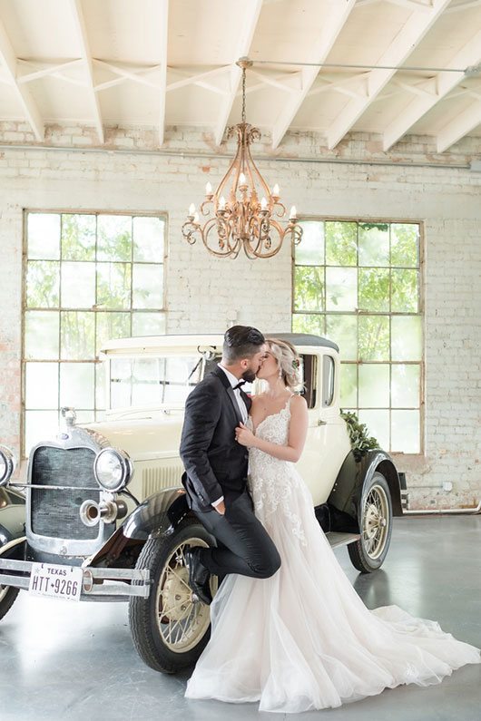 Vintage Copper Bride And Groom Kissing In Front Of Car