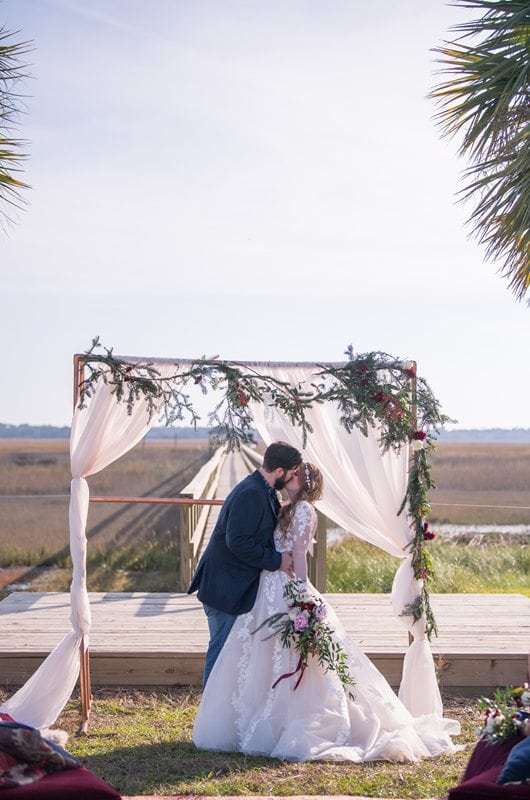 Charleston Christmas Wedding Ceremony Kiss