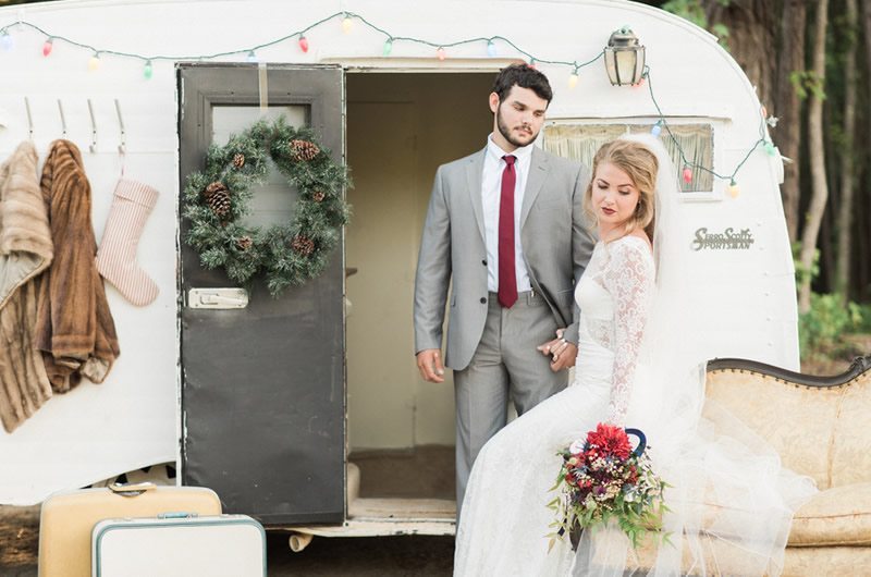 Eclectic Christmas Wedding Inspiration Christmas Bride And Groom In Front Of Airstream